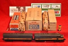 This is a picture showing ORIGINAL LIONEL 2378 MILWAUKEE ROAD AB UNIT IN MASTER CARTON - KILLER! - POSTWAR