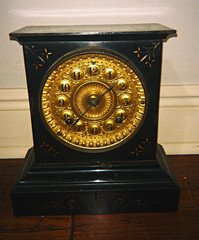 Ansonia Victorian style cast iron, with ornate gold metal face