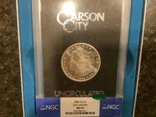 This is a picture showing 1885 CC morgan silver Dollar GSA MS 65 NGC and CAC