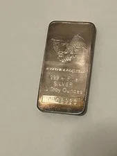 This is a picture showing Engelhard 10 oz Silver Bar 999+ Vintage