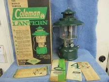 This is a picture showing COLEMAN MODEL 228E LANTERN IN BOX DATED 9-62