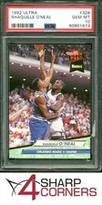 This is a picture showing 1992 ULTRA #328 SHAQUILLE O'NEAL RC MAGIC HOF PSA 10