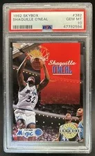 This is a picture showing 1992-93 Skybox Shaquille O'Neal Rookie RC #382 Magic PSA 10 GEM MINT