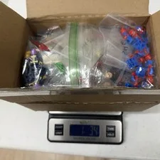 This is a picture showing LEGO Marvel Super Heroes Minifigures Bulk Lot 1 lb 3.4 oz Genuine Figures Parts