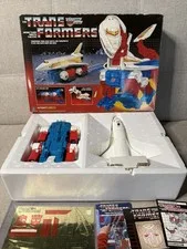 This is a picture showing 1986 Transformers G1 SKY LYNX 100% Complete & Unused w/ Original Box Vintage 