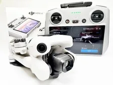 This is a picture showing DAMAGED DJI Mini 4 Pro Camera Drone FLY OUT OF BOX, RC 2 Controller PLUS Battery