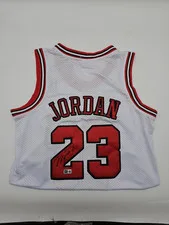 This is a picture showing MICHAEL JORDAN WHITE CHICAGO BULLS SIGNED #23 JERSEY AUTOGRAPH BECKETT LOA Q7398