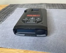 This is a picture showing Escort REDLINE 360C Radar Detector w/Mount