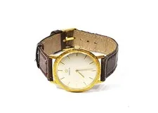 This is a picture showing Vintage Omega Solid 18K Gold Dress Watch – Manual Wind