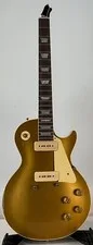 This is a picture showing Gibson Custom 1954 Les Paul Goldtop Murphy Electric Guitar - Gold - Snapped HS