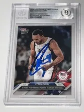 This is a picture showing 2024 Topps Now Olympic Games Auto Stephen Curry Signed Basketball Card BAS & BGS