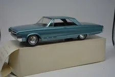 This is a picture showing VINTAGE  ORIGINAL 1965 CHRYSLER 300 PROMO MODEL 1/25 SCALE...STUNNING!!! W/BOX
