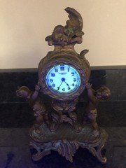 New Haven 1800s Gilt Cast Metal Cherub Mantel  Clock Uranium Glass Face Glows