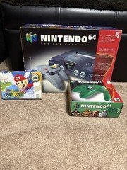 Nintendo 64 System-2 Controllers and Super Mario World 64. Tested 03/26.