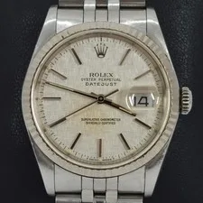 This is a picture showing 1990 ROLEX STAINLESS MANS DATEJUST WATCH 16234