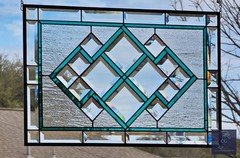 Teal green stained glass window panel with beveled , hanging 23 1/2"x 15 5/8"