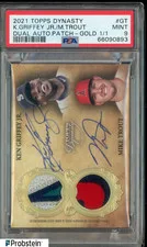 This is a picture showing 2021 Topps Dynasty Gold #GT Ken Griffey Jr Mike Trout Dual Patch AUTO 1/1 PSA 9
