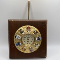 Vintage Fu Hsing Kang College Gold Tone 9 Mask Clock with a Wooden Frame.